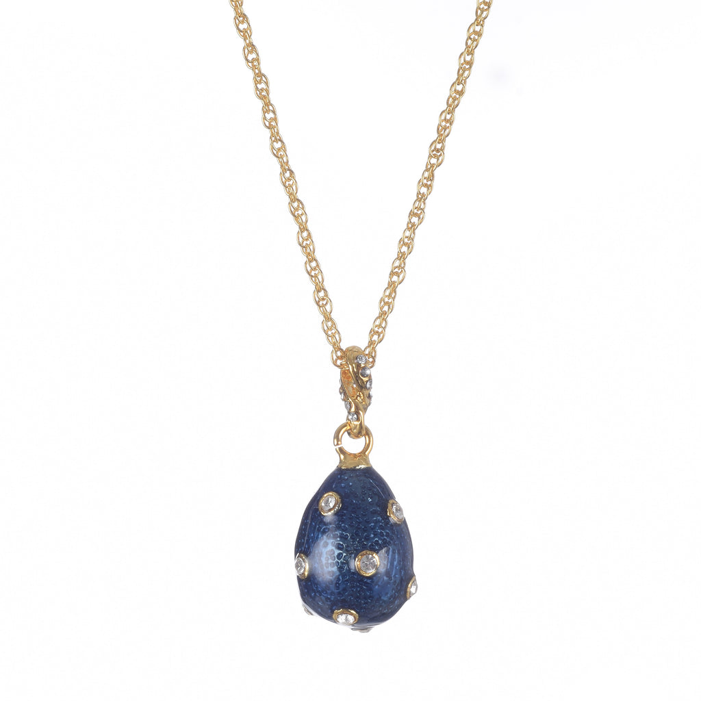 Blue pendant necklace with gold chain on a white background