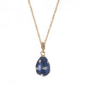 Blue pendant necklace with gold chain on a white background