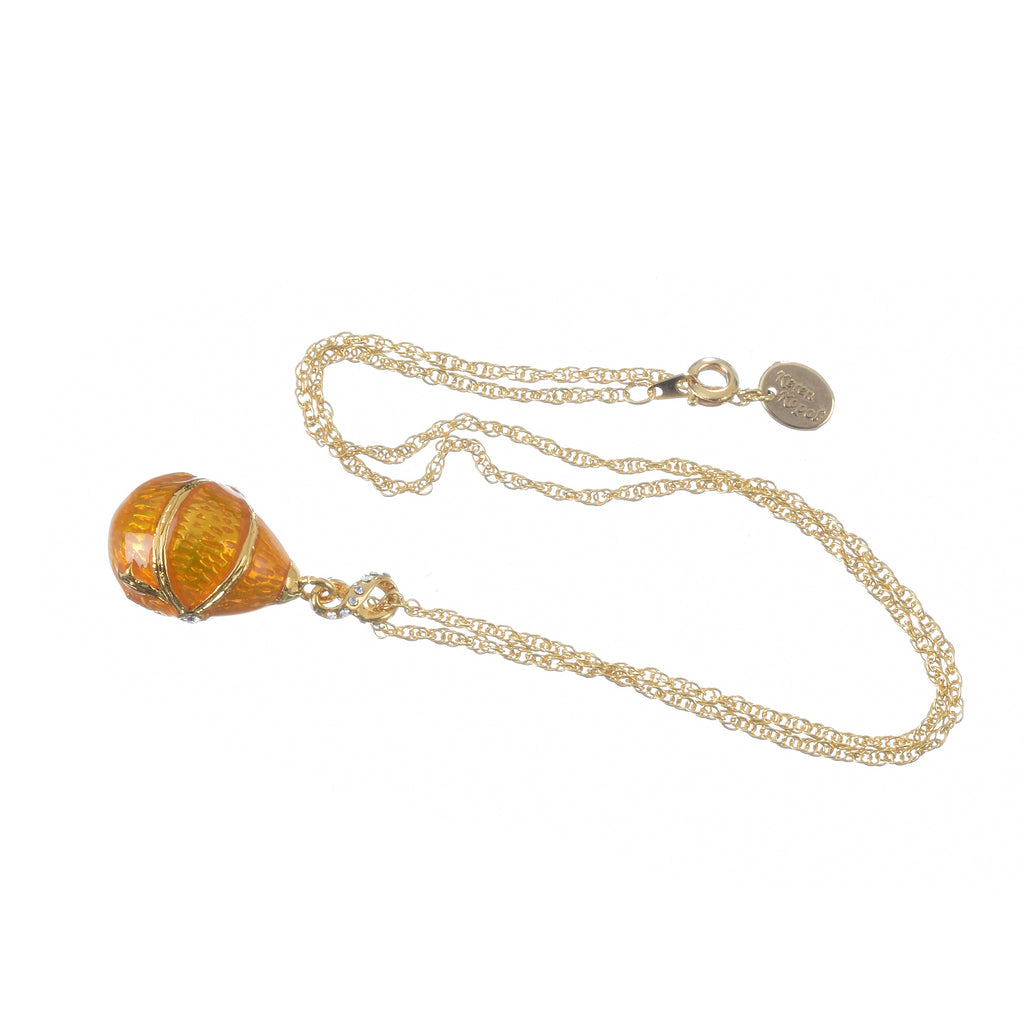 Decorative pendant with chain on a white background