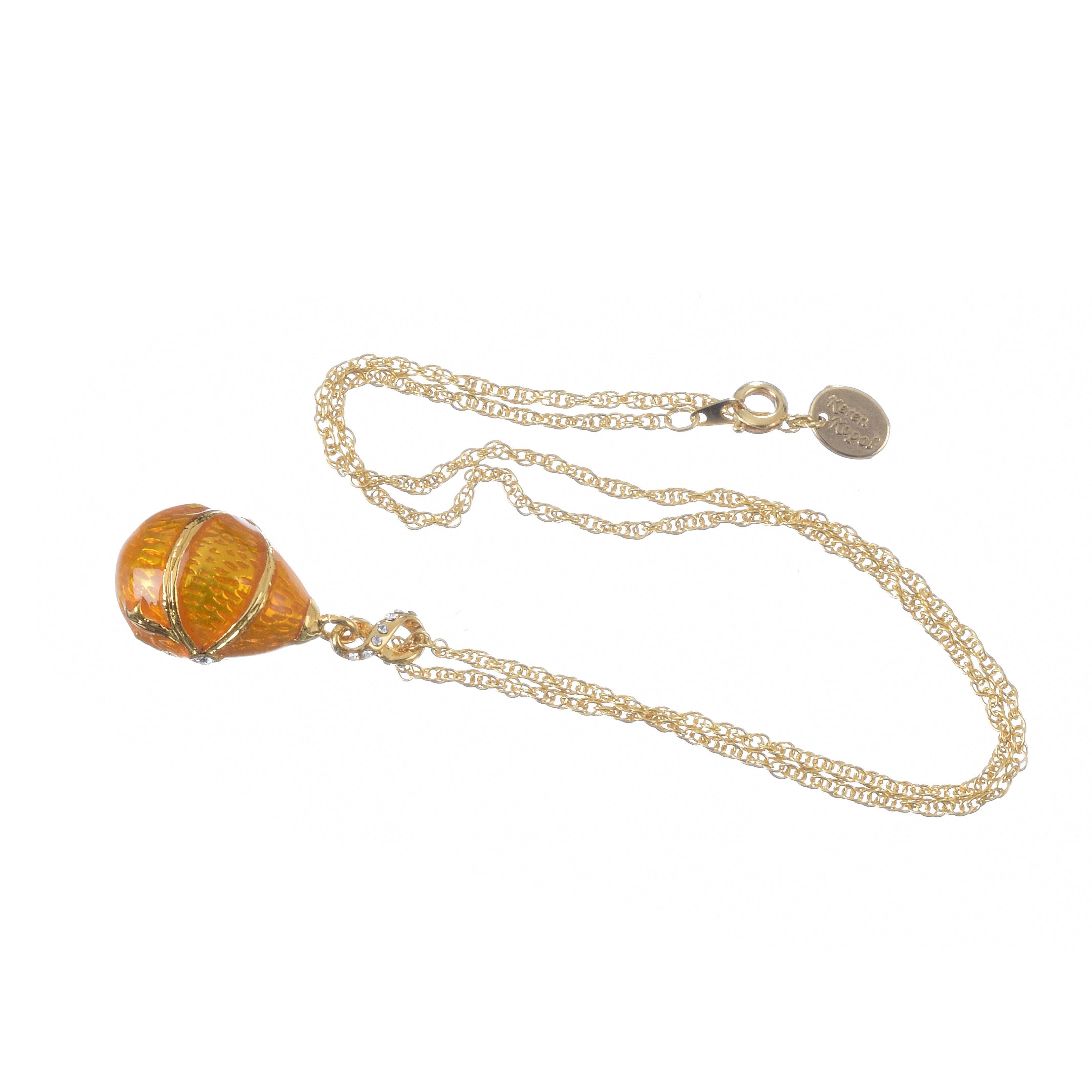 Decorative pendant with chain on a white background