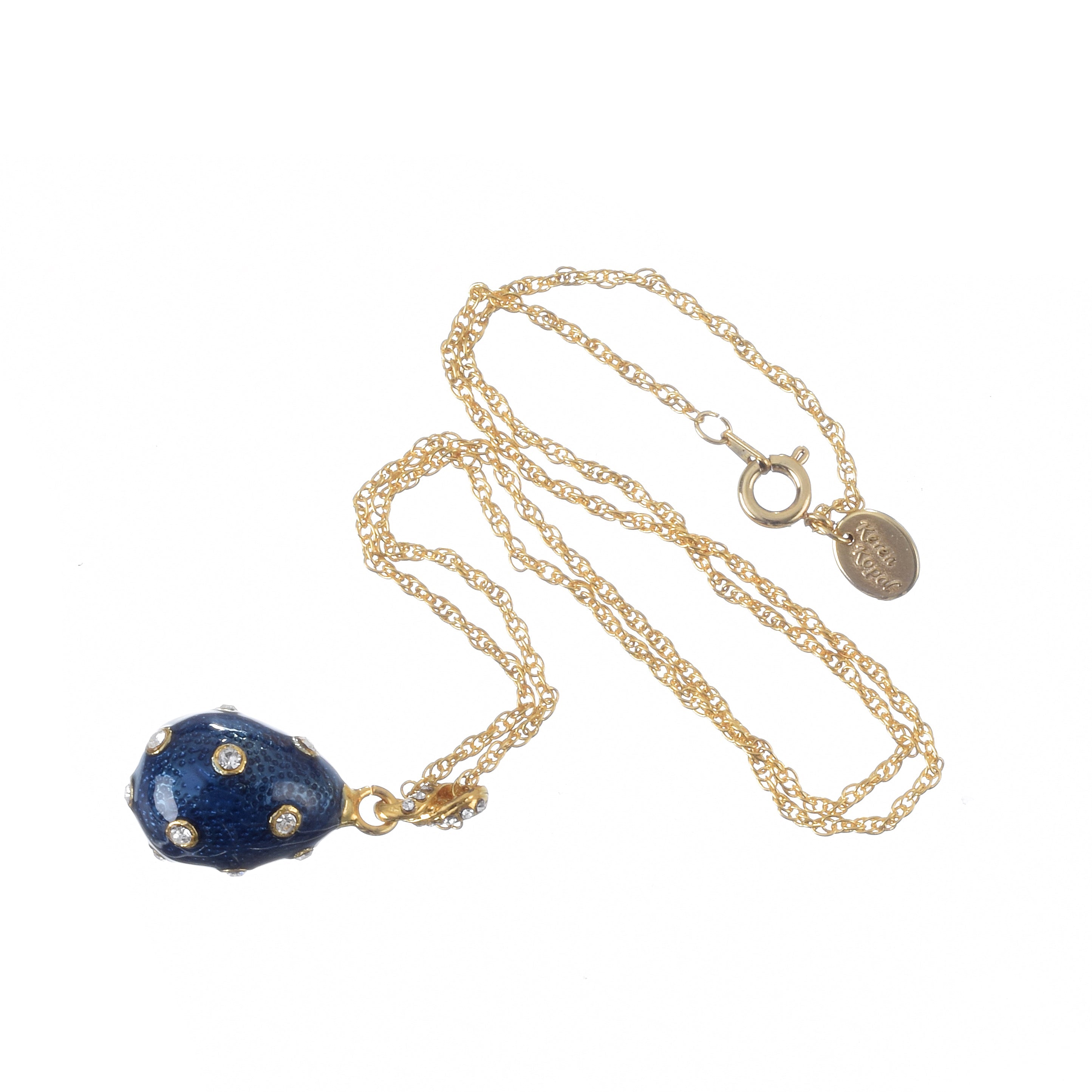 Gold necklace with a blue pendant on a white background