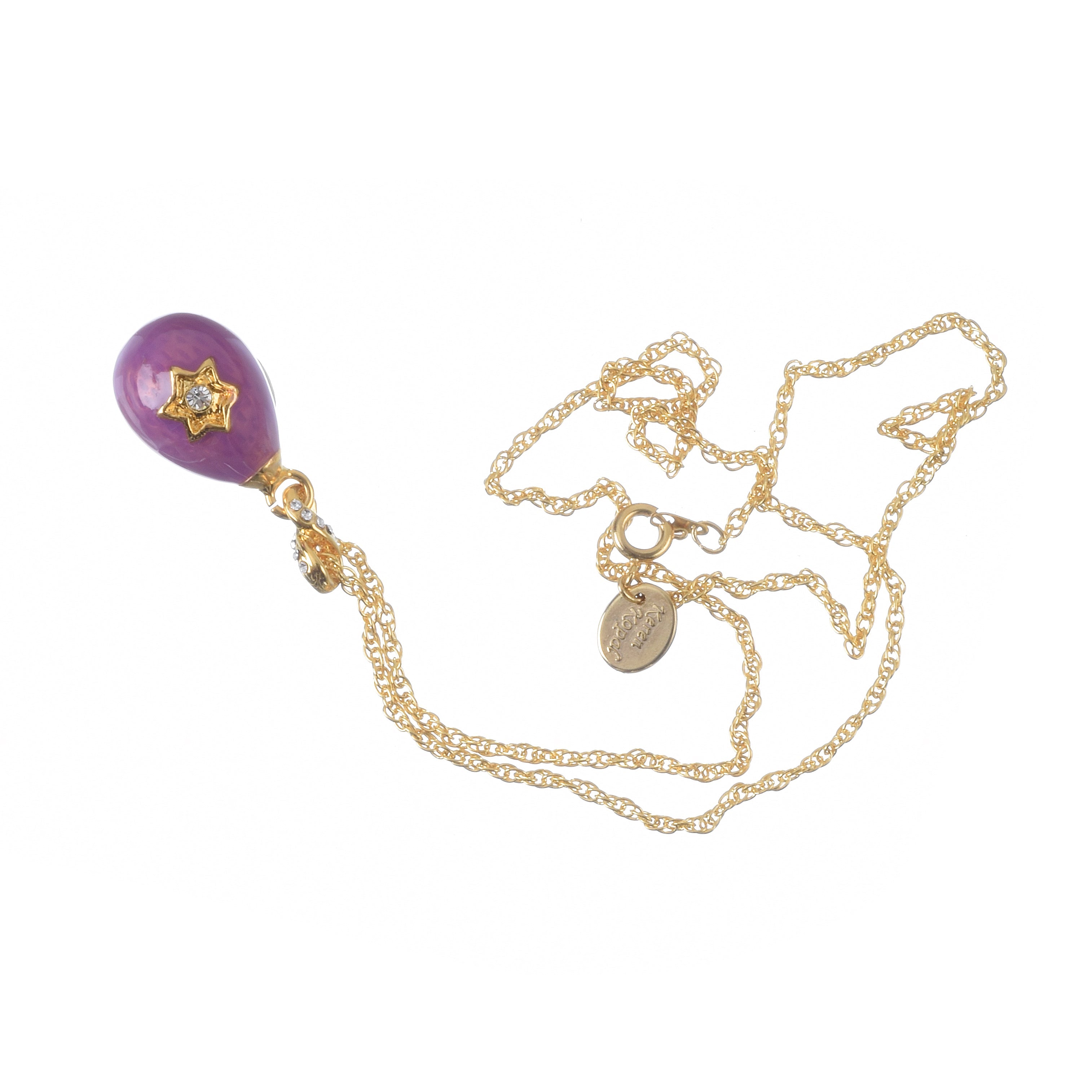 Gold necklace with a purple pendant on a white background
