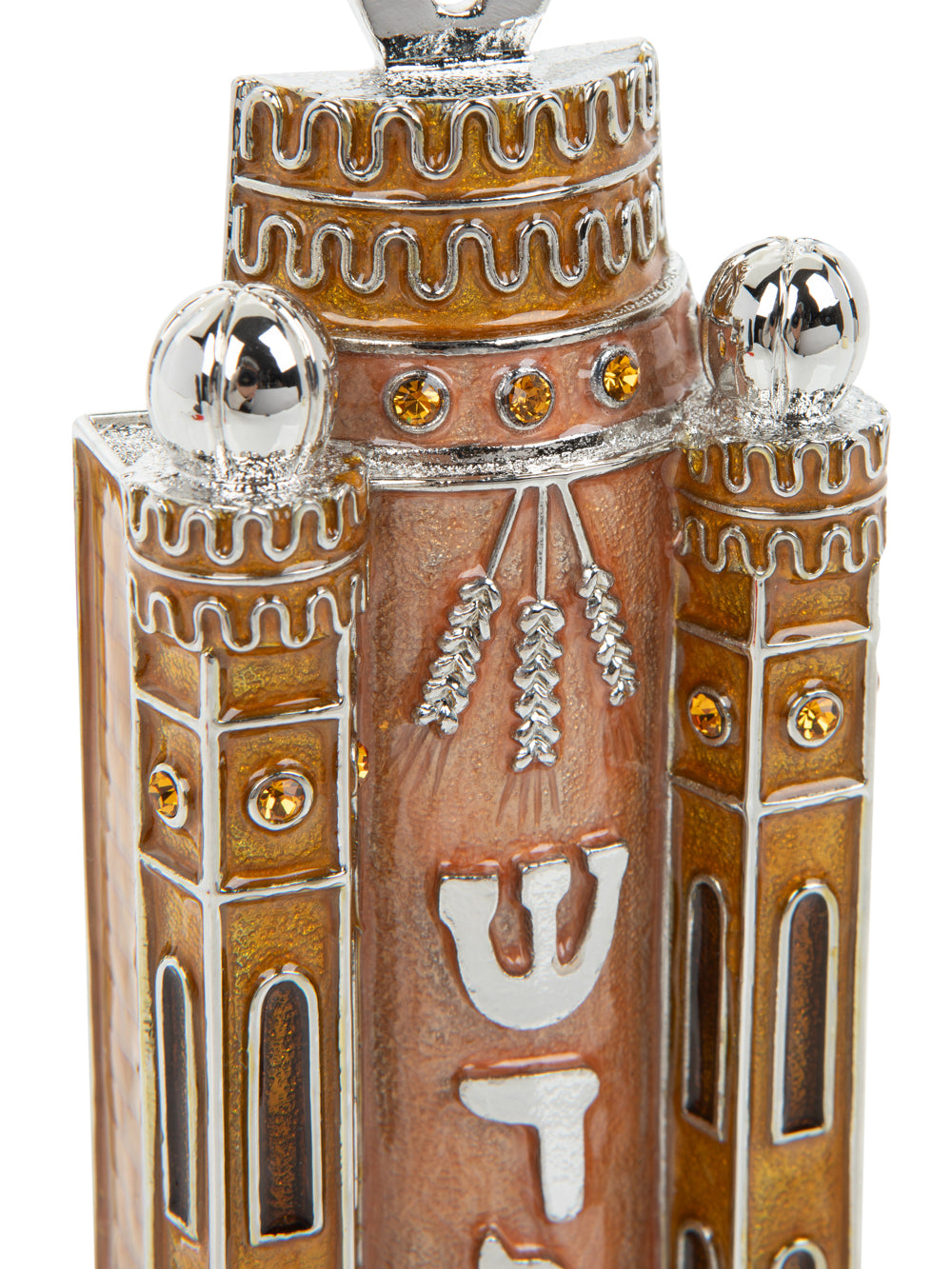 Decorative object with intricate design and Hebrew letters on a white background