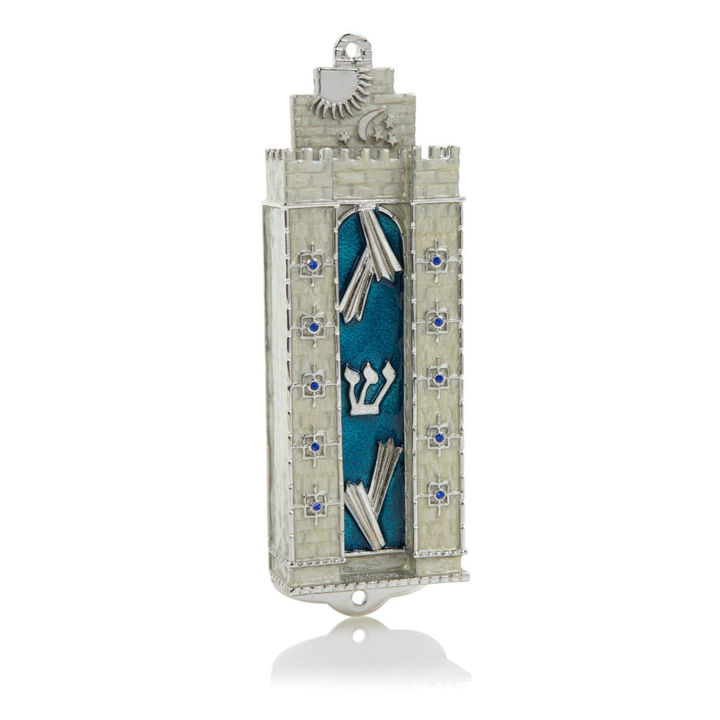 Decorative Mezuzah case with blue cover and silver details on a white background