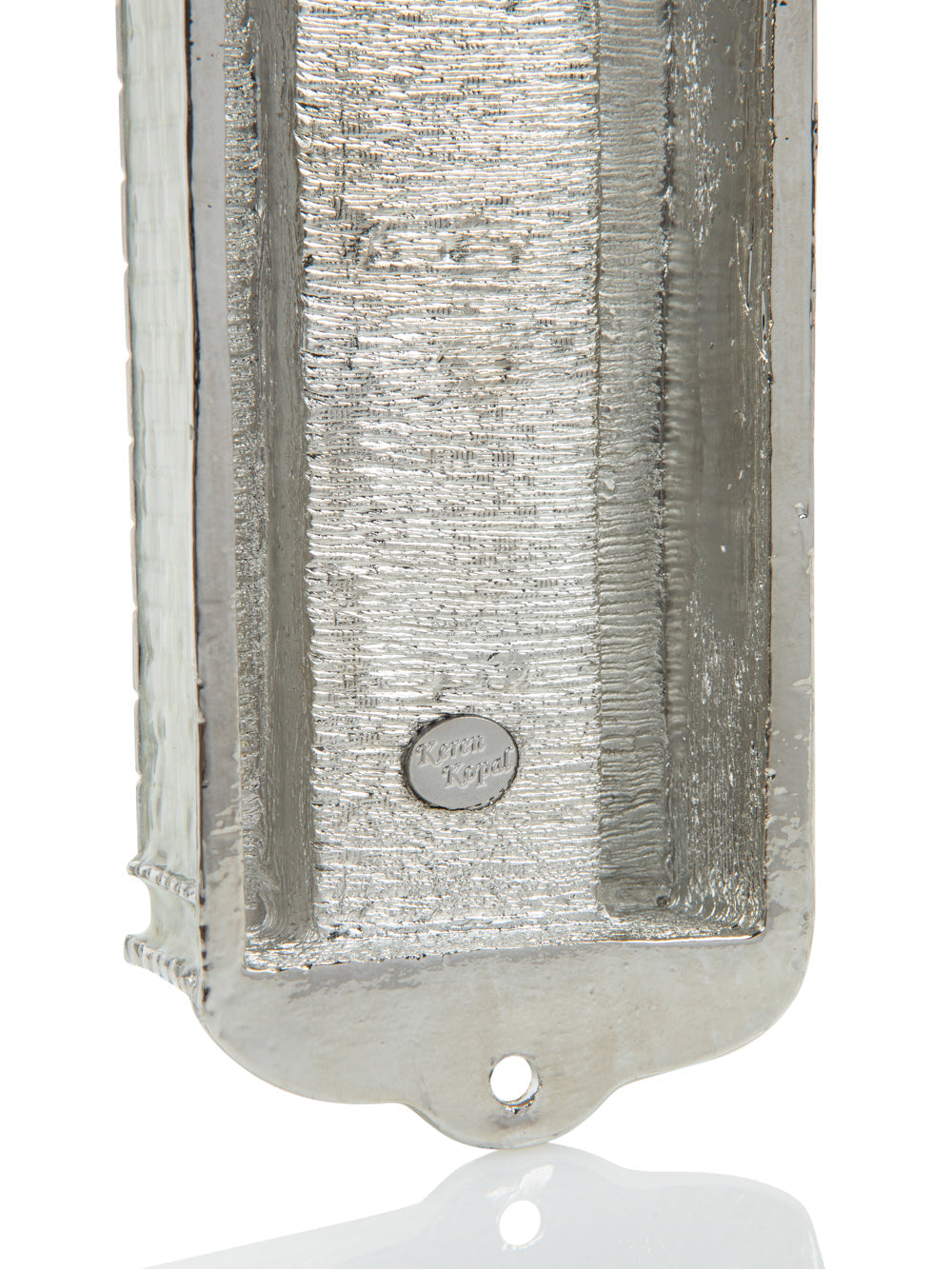 Metallic rectangular object with textured surface and brand logo on a white background