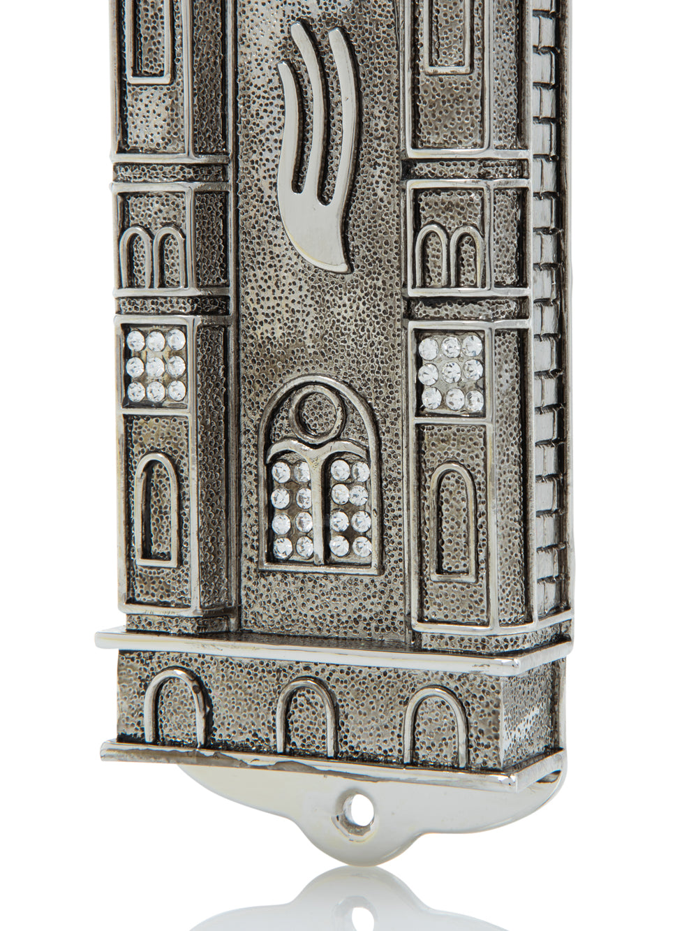 Decorative silver mezuzah case with intricate designs on a white background