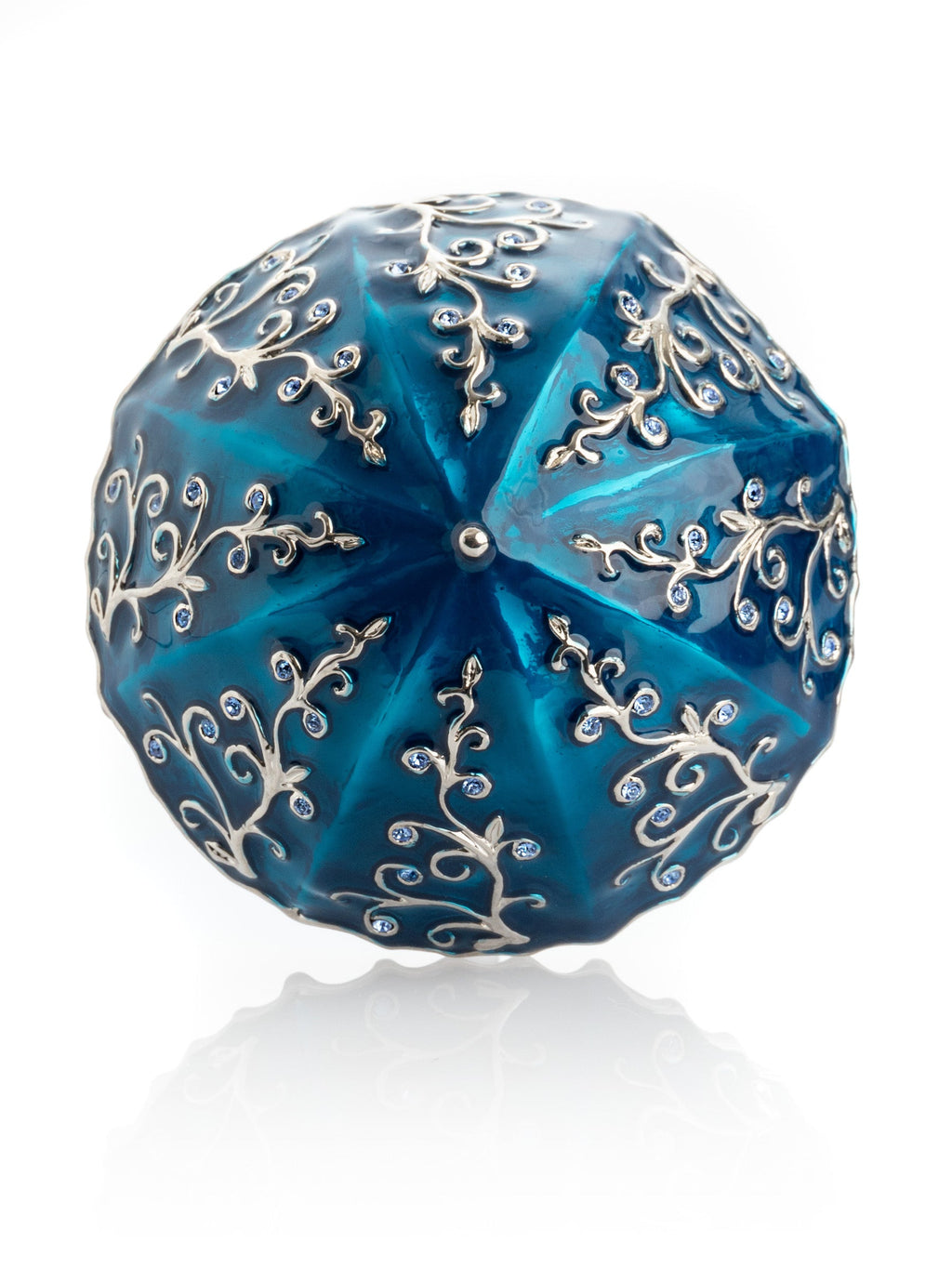 Blue decorative item with silver floral patterns on a white background