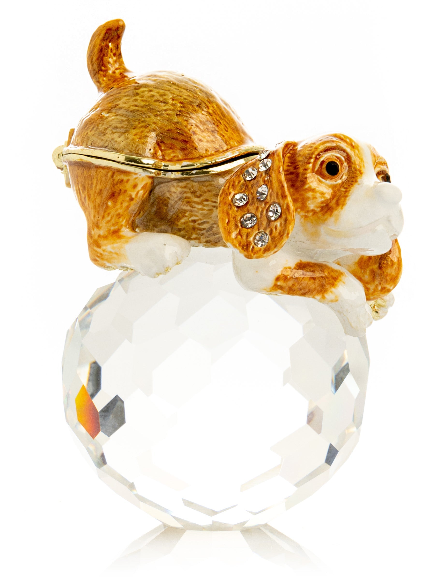 Ring with a dog-shaped charm on a white background