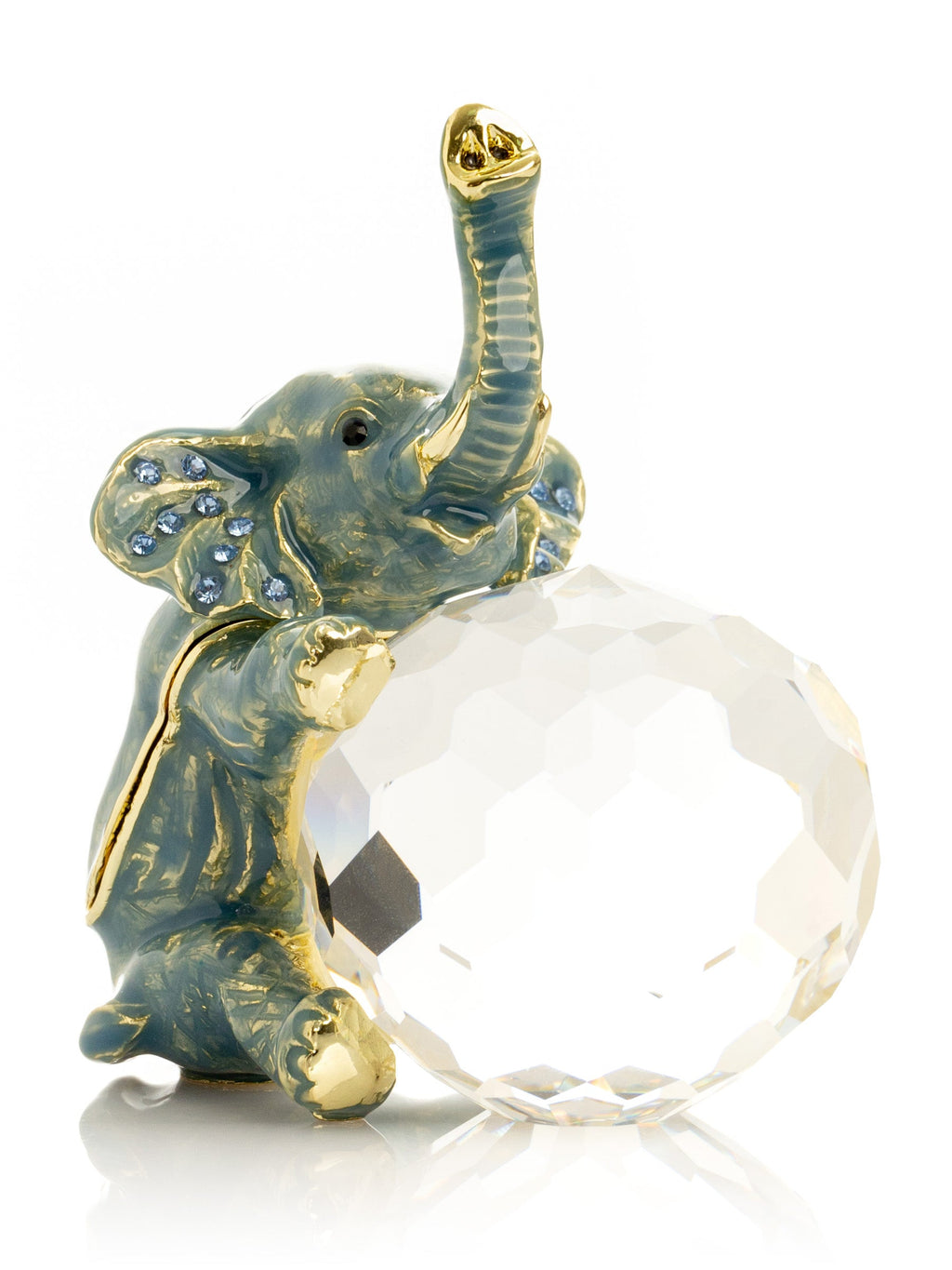 Decorative elephant figurine with a crystal ball on a white background