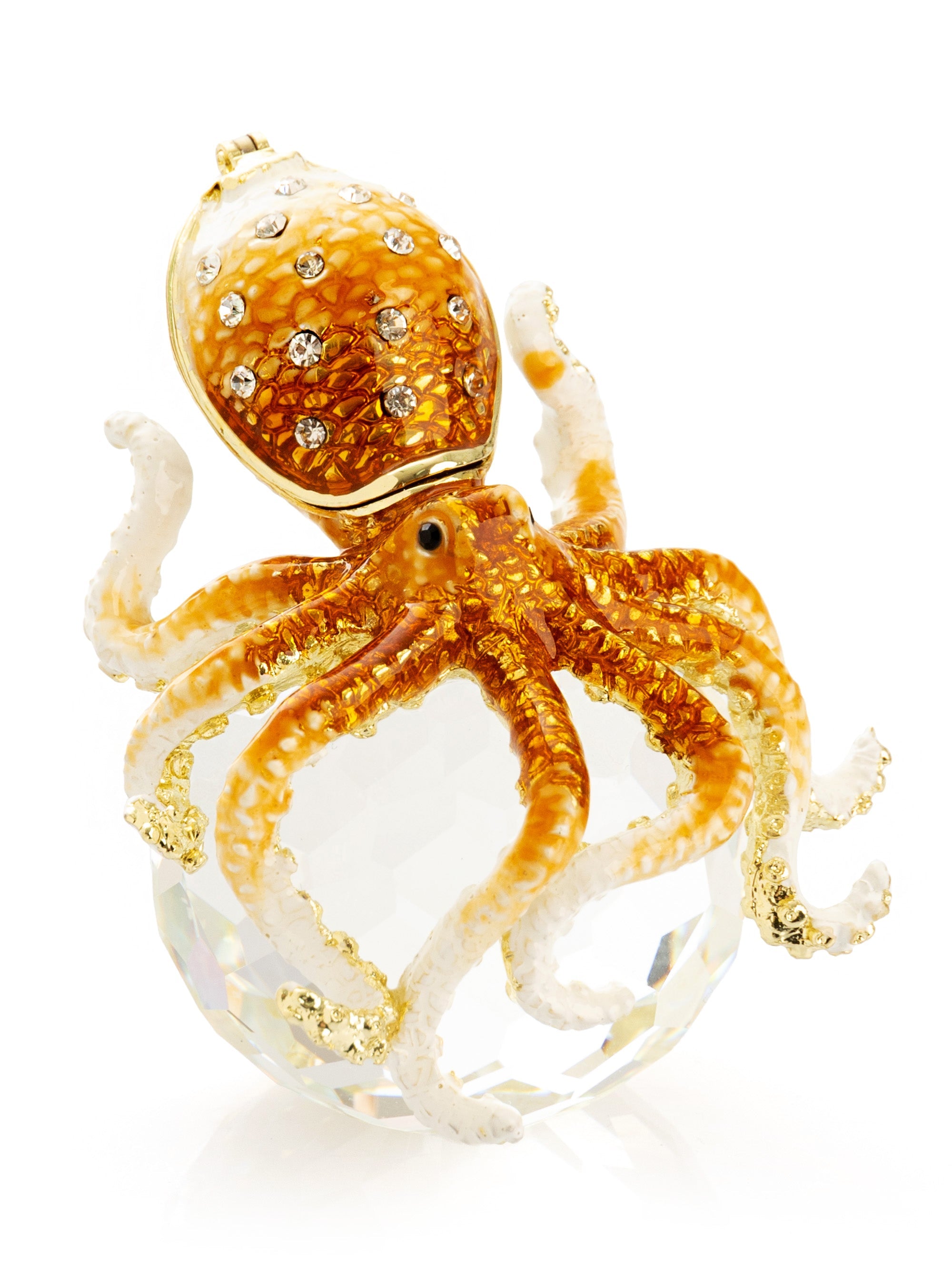 Gold and white octopus-shaped jewelry piece on a white background