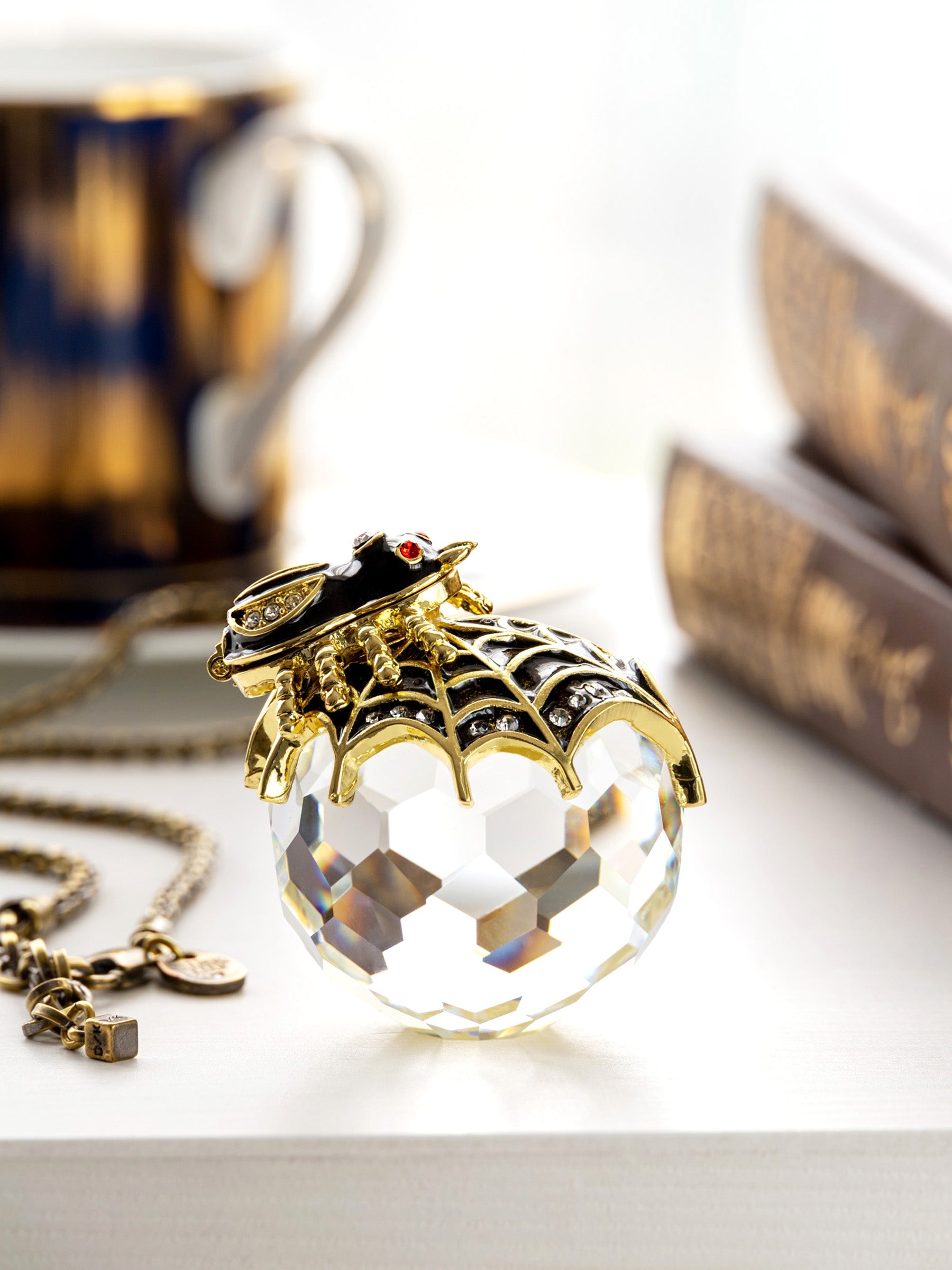 Crystal necklace with gold accents on a white surface