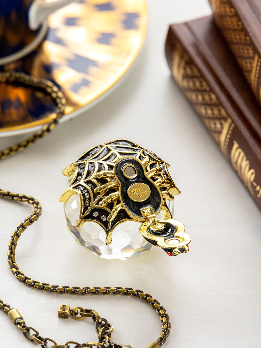 Detailed side view spider trinket box | 24K gold plated filigree with black enamel, red crystal eyes, Austrian crystals and gold chain | RV Luxury handcrafted collectible keepsake