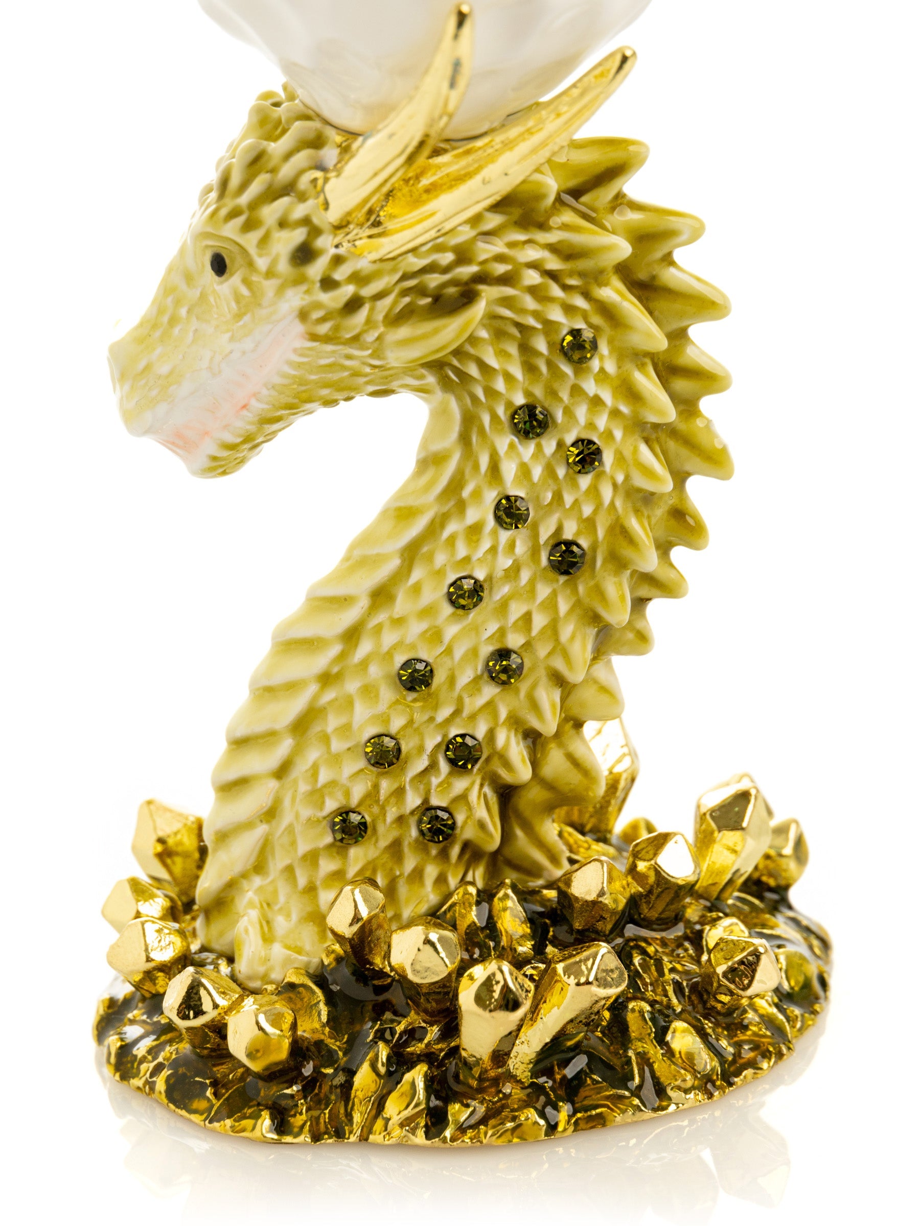 Decorative figurine of a dragon with gold accents on a white background