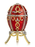 Decorative red egg with gold accents on a white background