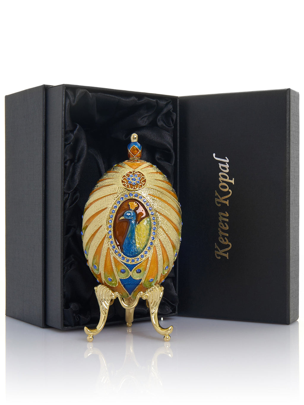 Decorative egg with peacock design in a Keren Kopal box