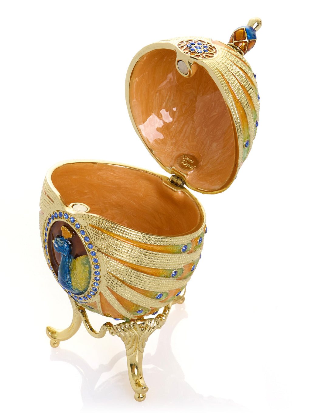 Decorative egg with gold and blue accents on a white background
