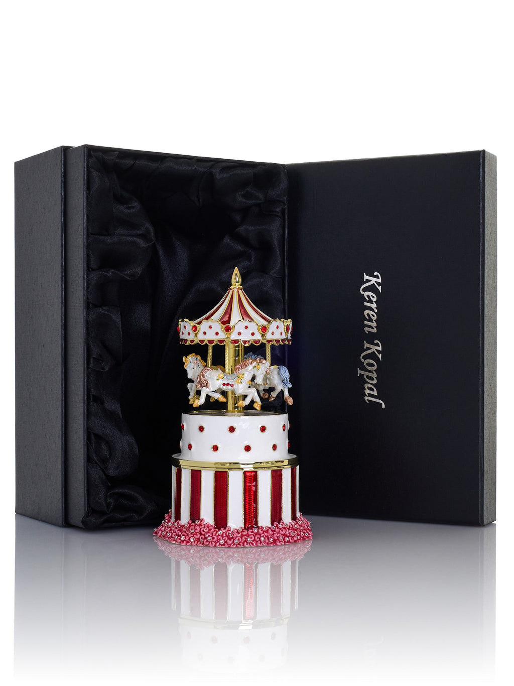 Decorative carousel figurine in a black box with 'Keren Kopal' branding.