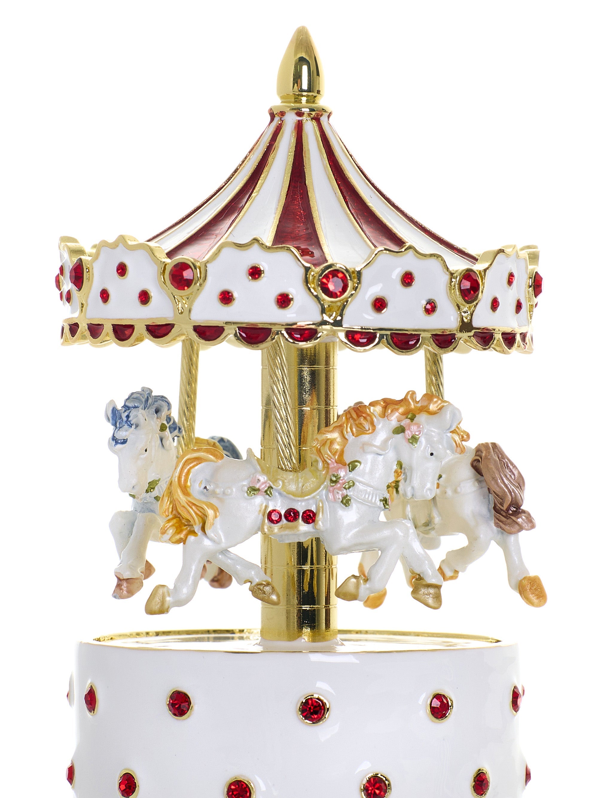 Decorative carousel figurine with horses on a white background