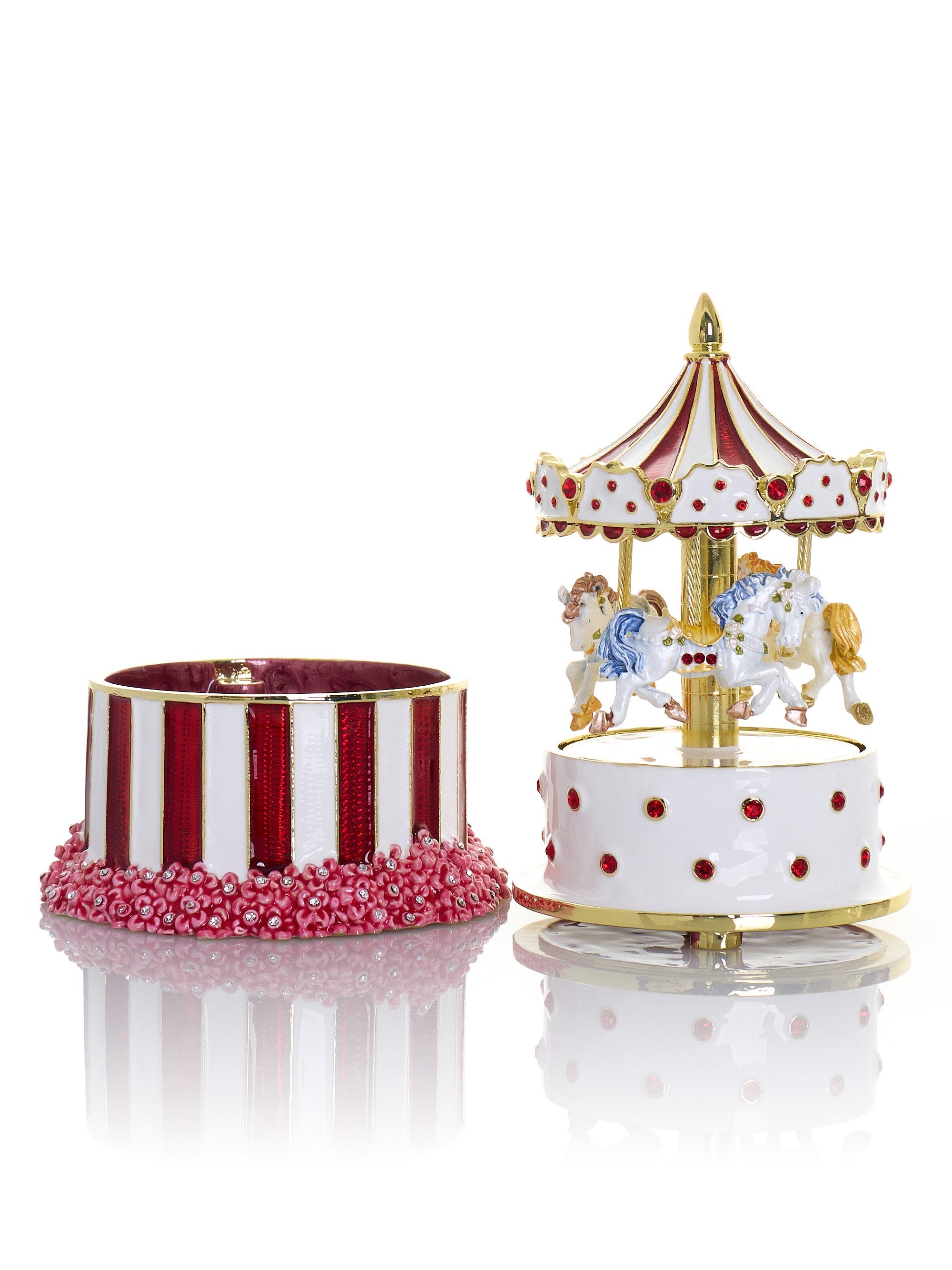 Decorative carousel with red and white striped base and gold accents on a white background