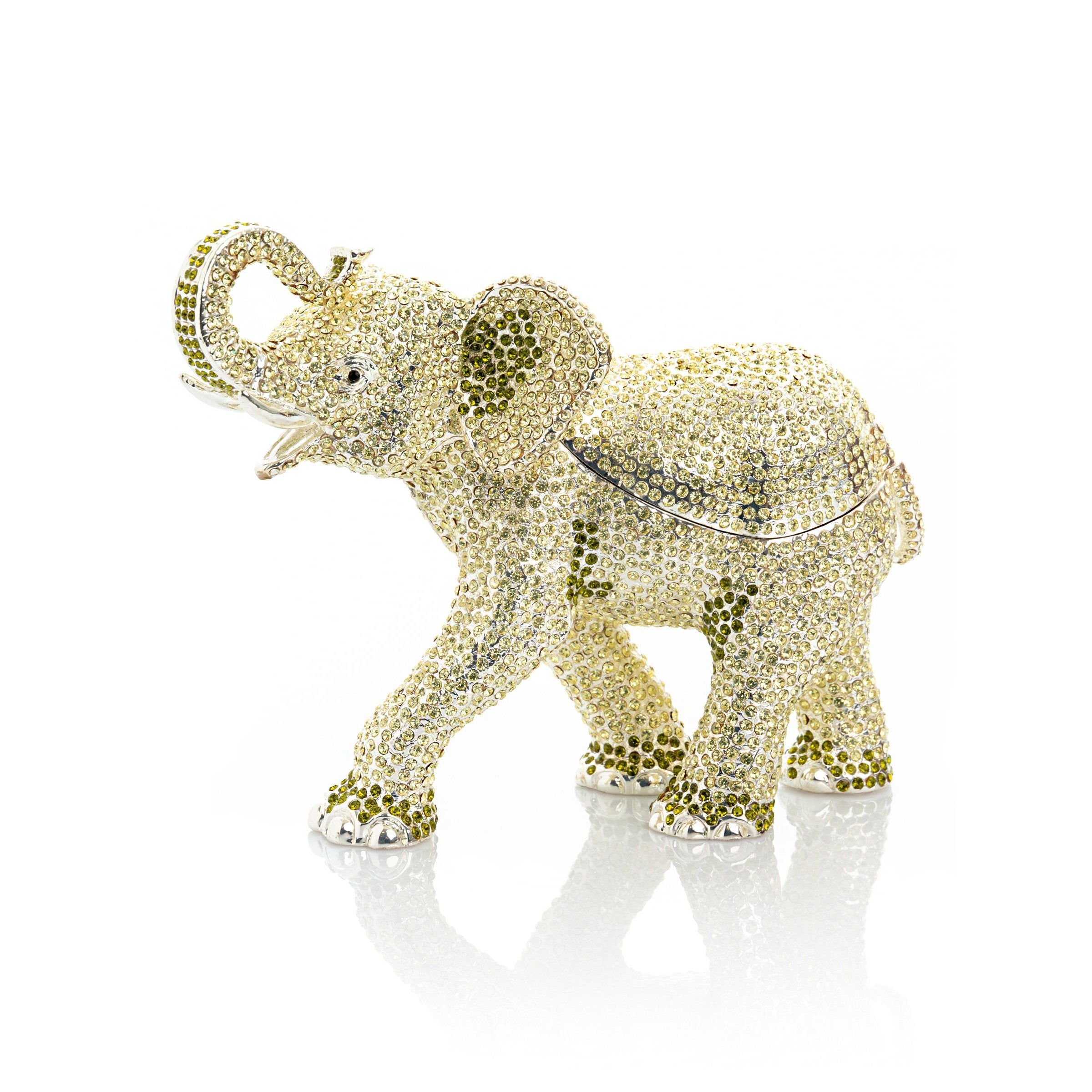 Decorative elephant figurine with gold and silver embellishments on a white background