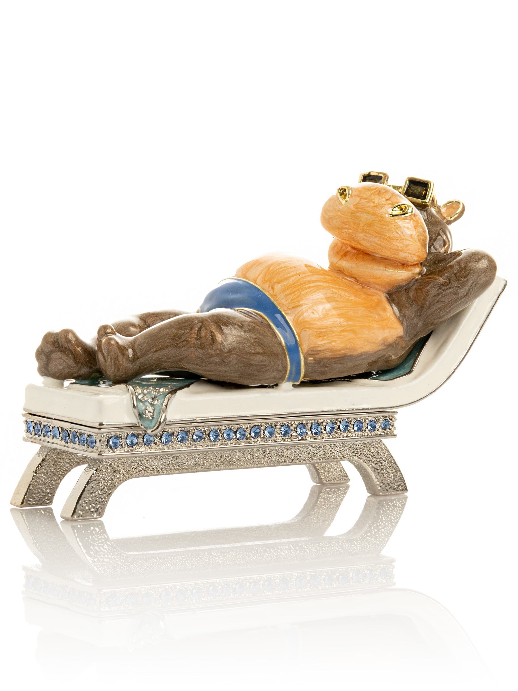 Decorative figurine of a hippo lounging on Poolside sunbed
