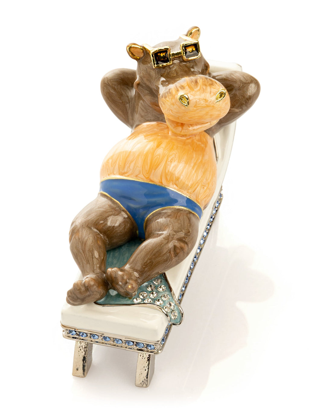 Decorative figurine of a hippo on a chair with decorative elements