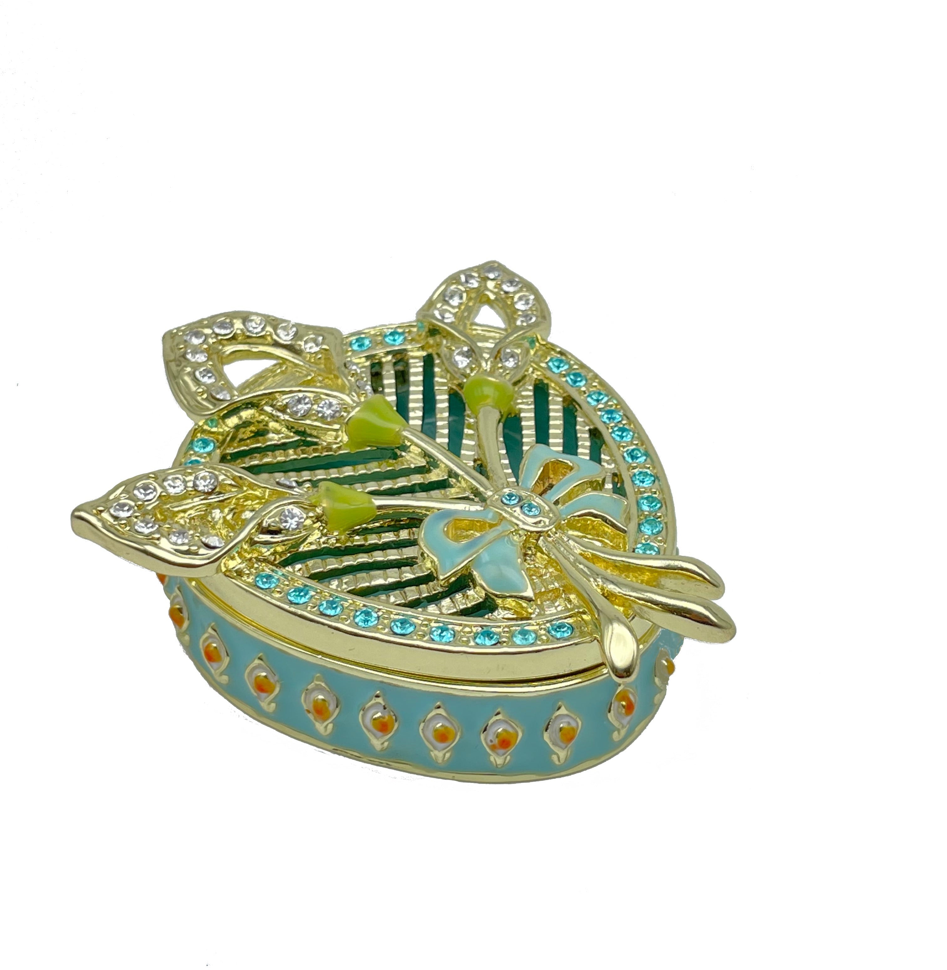 Decorative jewelry box with gold, green, and blue colors on a white background