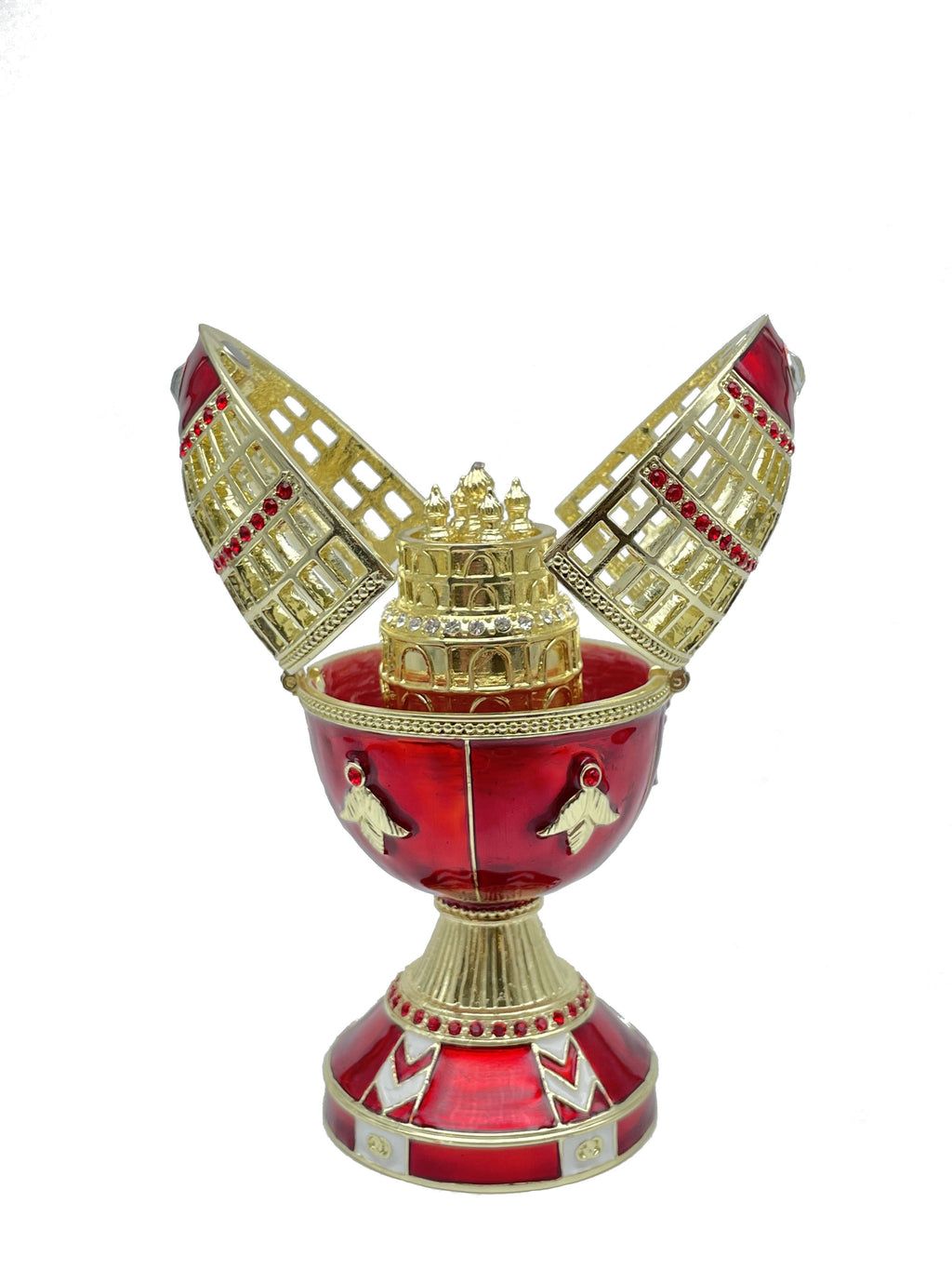 Decorative red and gold object with intricate design on a white background
