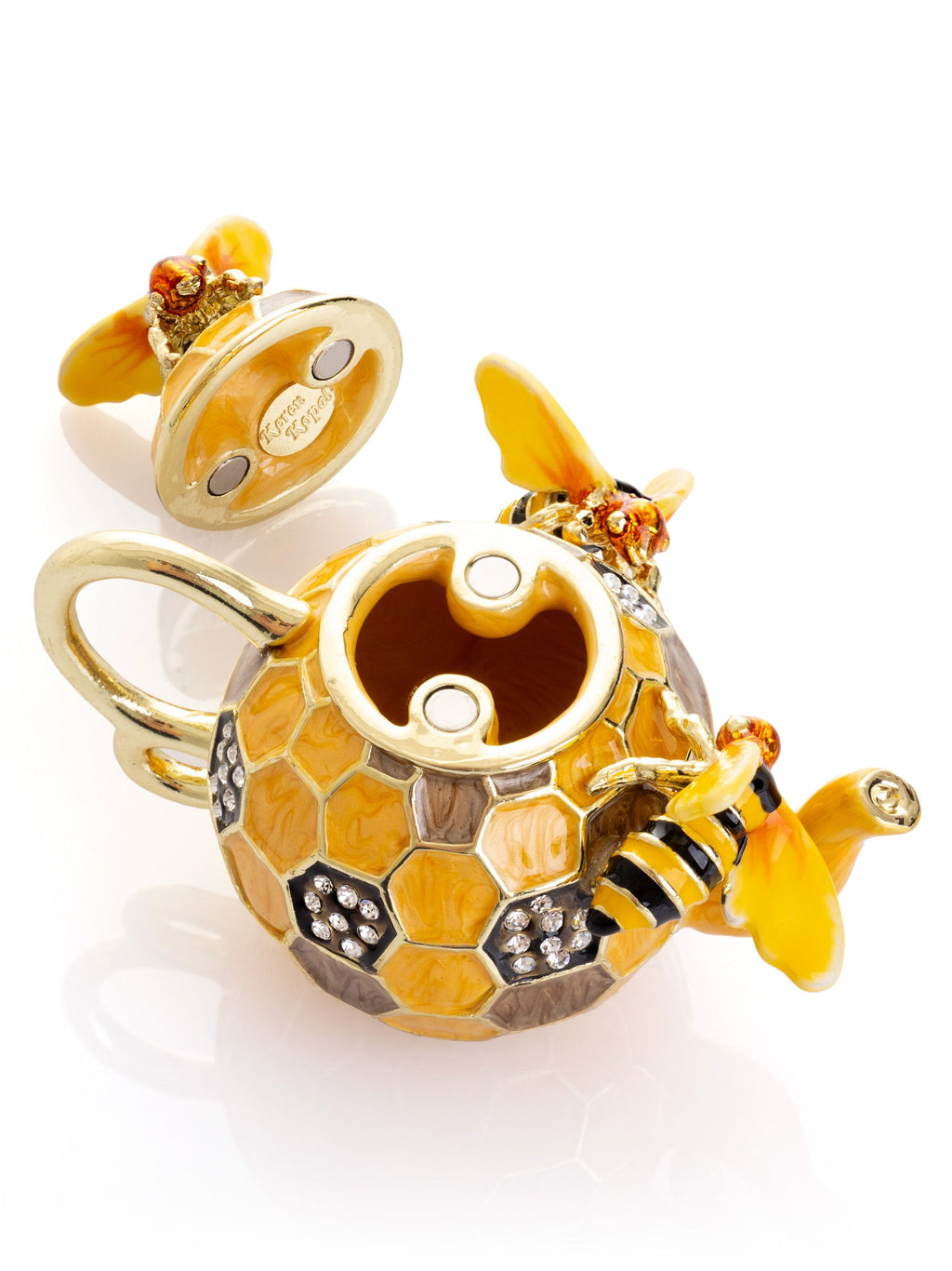 Decorative honeycomb charm with a bee on a white background